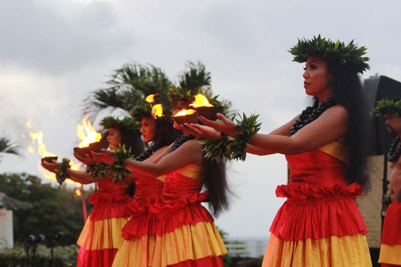 Dancers holding fire